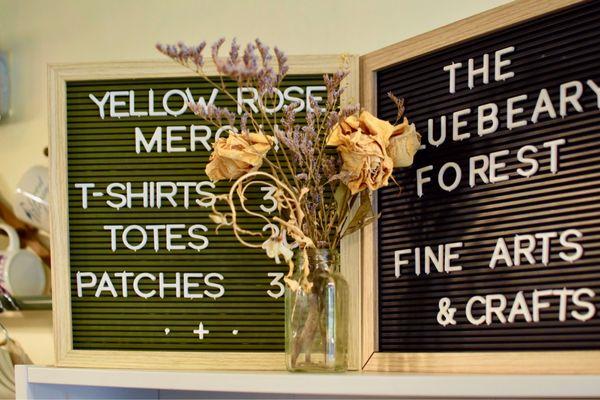 Yellow Rose and Bluebeary Forest handmade merchandise including art prints, t shirts, patches, and totes