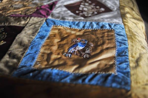 Hand made velvet quilt that was a wedding present for Emma Bray in 1884