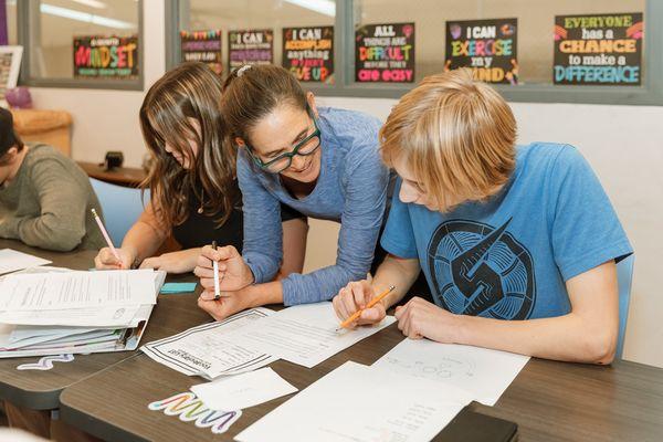 In Spanish class, a Jr. High student and teacher work together to learn new vocabulary words.