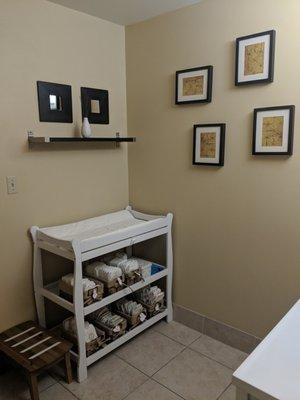 Changing table with all sizes of diapers.