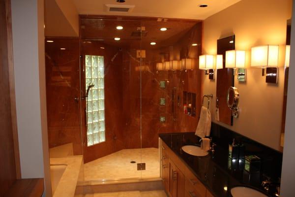 A floor to ceiling steam unit turns this remodeled bath into pure luxury!