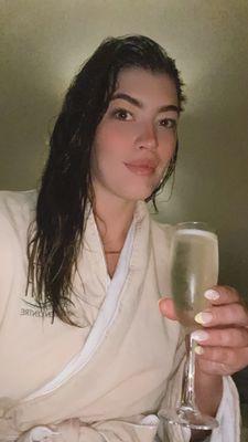 Included 1 glass of champagne robe towels sandals