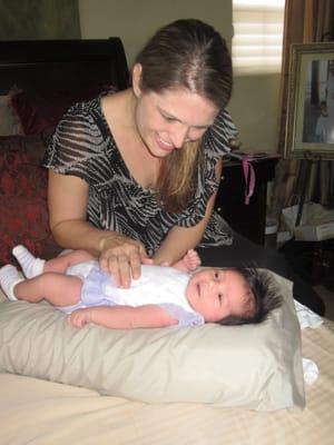 Dr. Olivieri & our baby's first adjustment at 8 days old.