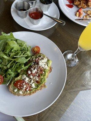 Avocado toast and strawberry Belgian waffles