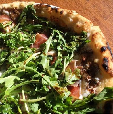 Prosciutto & arugula pizza at the Tremont Farmers Market