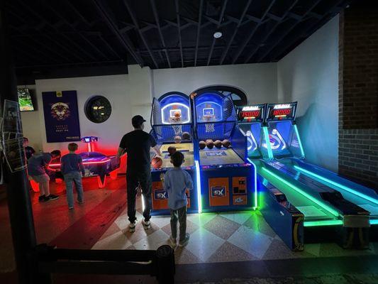 Basketball, skee ball, and air hockey arcade games.