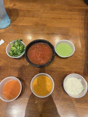 Assorted salsas from the bar.  All but red and white pack a spicy punch.