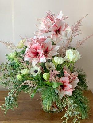 A holiday arrangement in red, white and blush