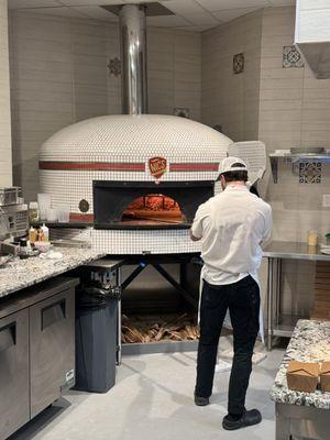 Nic's Pizza  Oven. Master Pizza maker Tyler at work