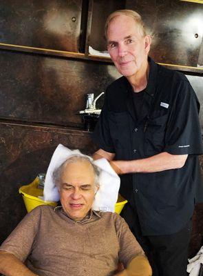 Master barber Tom, also one of the co-owners, shampooing his client's hair in the specially-equipped shampoo room.