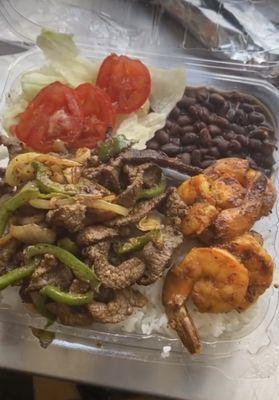 Black beans pepper steak simple lettuce and tomato salad white rice