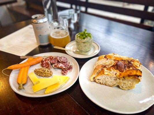 Saucisson Sec, Leelanau Raclette, mustard & pickled carrots, Sourdough Focaccia with Squash & Red Onion, Rainbow Trout Rillettes & herbs.