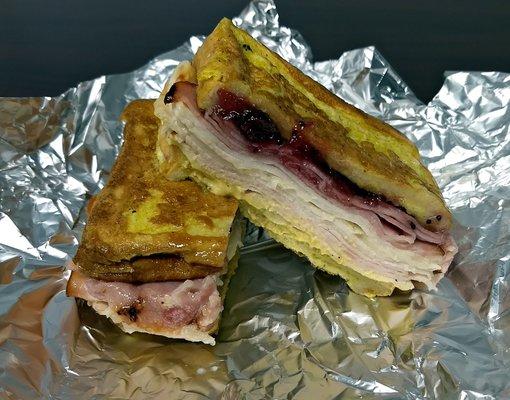 Monte Cristo: Texas French toast, baked ham, turkey, swiss, cranberry and dijon mustard. Delicious!