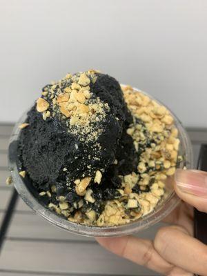 Charcoal icream with peanut topping