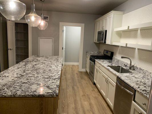 Kitchen cleaned for check out.  Bins were removed from the refrigerator and freezer washed and put back.