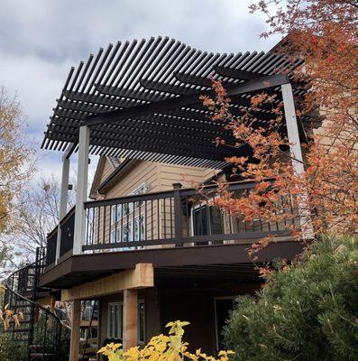 Shaped pergola over deck