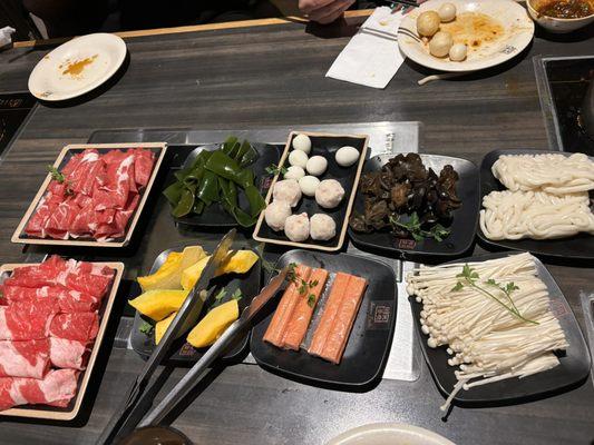 lamb, beef, seaweed, pumpkin. quail eggs, lobster balls, crabsticks, wood ear mushrooms, udon noodles, enoki