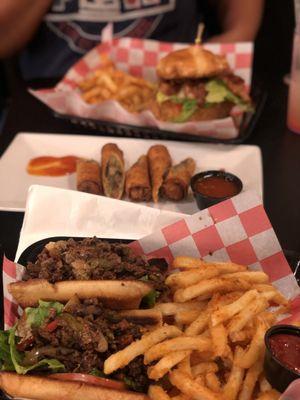 Philly Cheesesteak with Fries , and Philly Cheesesteak Egg Rolls Appetizer