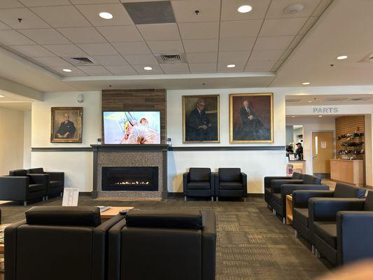 Quaint and quiet waiting area! Love the portraits of the family!!