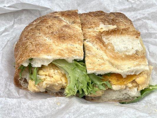 Mashed chickpea panini (vegan) - mashed chickpeas, baby greens, roasted yellow tomato and drizzle of evoo