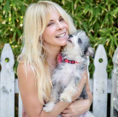 Lisa Arturo (founder) with a rescued dog