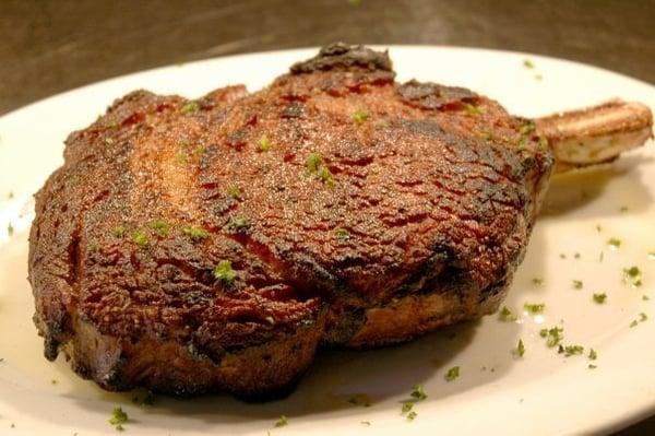 22 oz. Prime Bone-in Rib Steak- Pittsburgh Style and brushed with clarified butter.