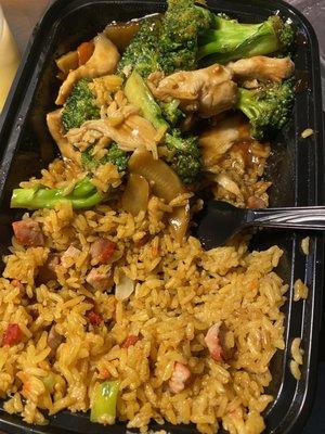 Half eaten chicken with broccoli and fried rice