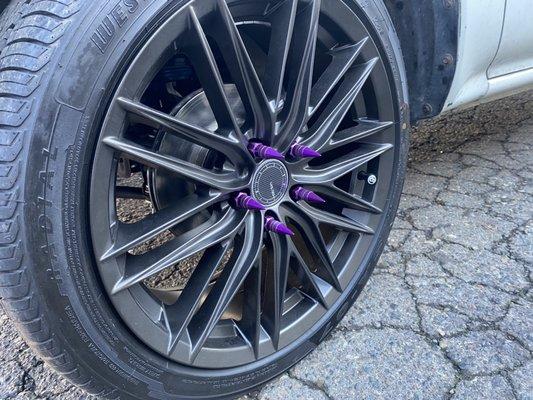 Custom 18 inch wheels with spiked purple lug nuts