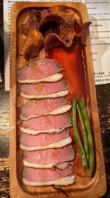 Smoked duck - thin sliced coffee cured duck with sweet potato crisps, pickled long beans, and a sour cherry sauce