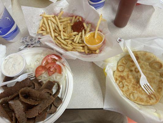 Gyro plate with Pita and fries with a side of cheese