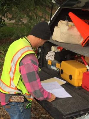 Reviewing things from his truck