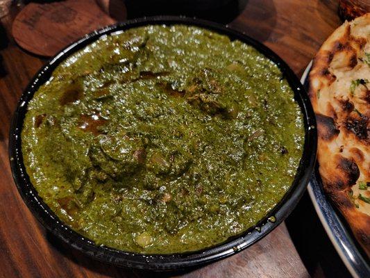 Saag with goat, very tasty but beware of bones