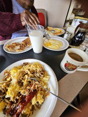 Hard grits, 2 sets of eggs, cause the first order was wrong, anorexic waffle, and hard hash browns.