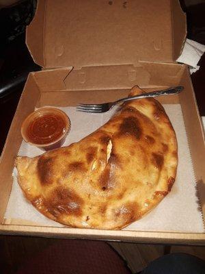 This picture makes this calzone look larger than it is. Not happy at all with this, it look like and tasres like a pre manufactured item.