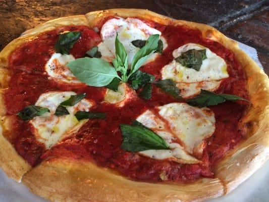 Margherit's getting saucy pizza- Thick San Marzano tomato sauce, fresh buffalo mozzarella, fresh basil, cracked black pepper