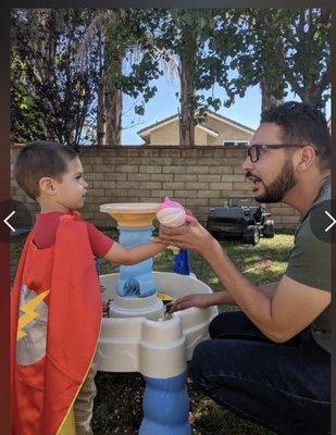 Speech Pathologist, Ryan Perez-Carrillo, CCC-SLP, providing speech therapy to a child. Photo credit Vibrant Therapy Inc. 2022.