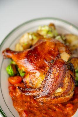 Smoked Chicken - Smoke-Roasted Half Chicken. Sautéed Brussels & Roasted Red Peppers. Smashed Potatoes. Grilled Lemon.