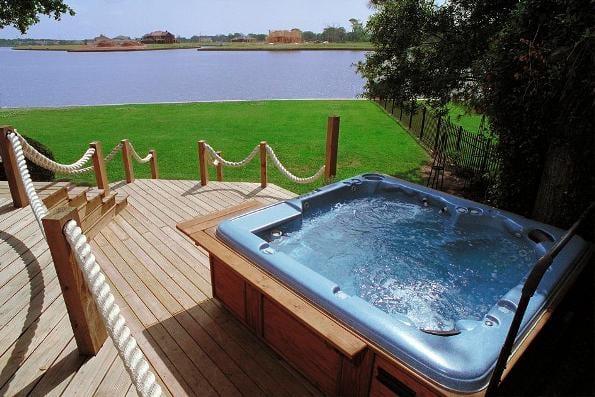 Custom Accent Spa & Decking with a Water View