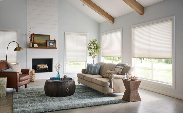 Comfortable living room with complimentary cellular shades