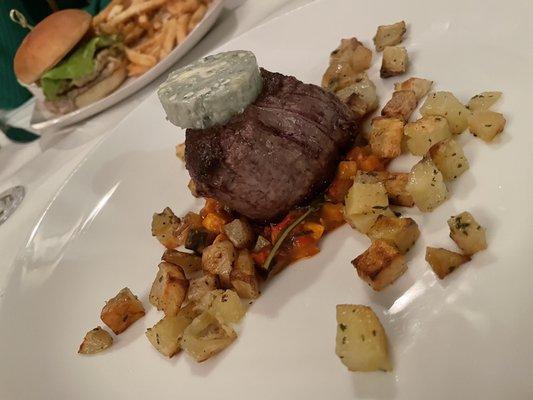 Filet Mignon over ratatouille and potatoes, blue cheese butter on top