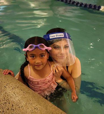 My daughter with her first swim instructor, Ms. Madison.