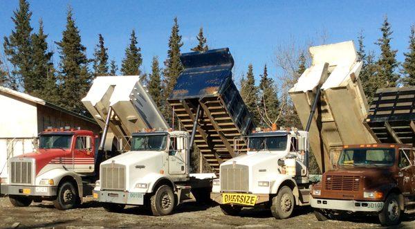 Need topsoil or gravel delivery? We have dump trucks and side dump to bring you the material you need!