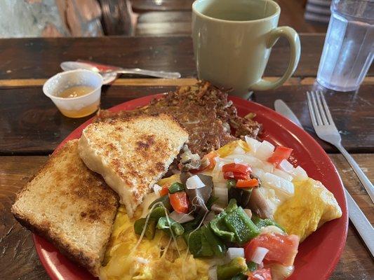 Veggie omelette, homemade sourdough toast, hash browns and Twinings English Breakfast Tea with honey.