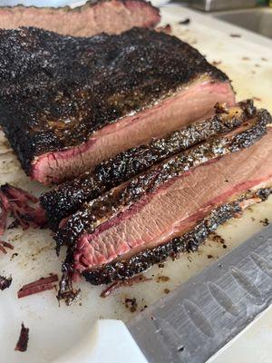 USDA Prime slow smoked sliced beef brisket with simple salt and pepper rub.