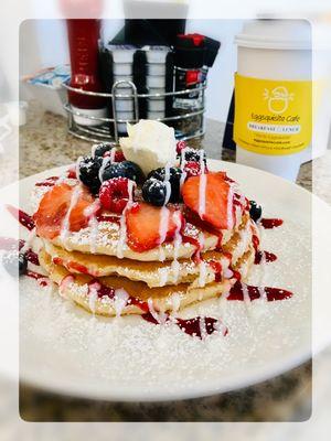 Very Berry Pancakes - topped with mascarpone cheese, fruit, vanilla and a berry glaze.  Available with french toast, waffles and crepes.