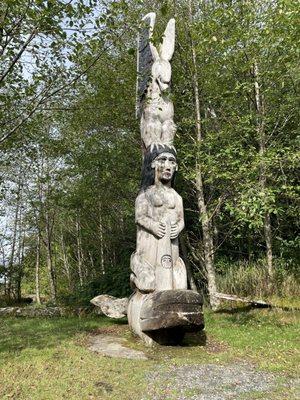 Totem pole of woman on a whale