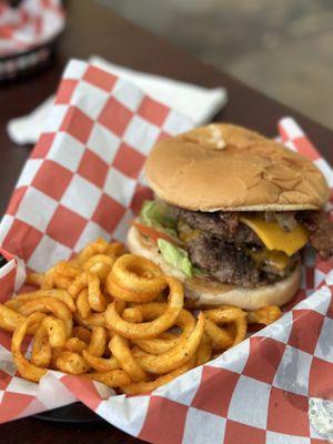 Double bacon cheeseburger with curly fries