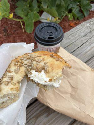 About to eat a toasted sunflower seed flagel with cream cheeses!