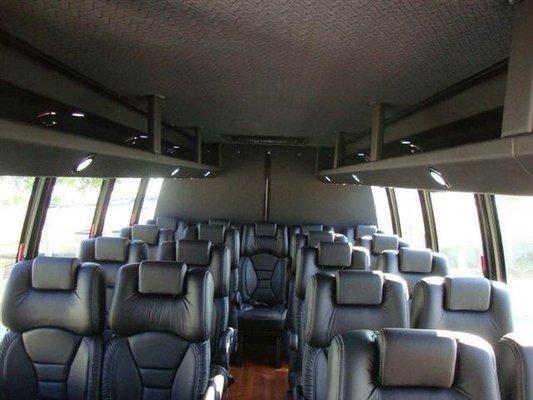 Middle size luxury bus with leather seat.