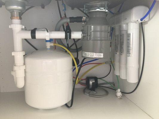 This is our reverse osmosis system with an added little pump to get the filtered water to our refrigerator.